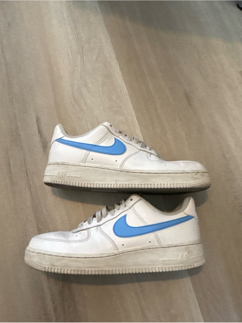 Nike White Low-Top Sneakers with Sky Blue Swoosh